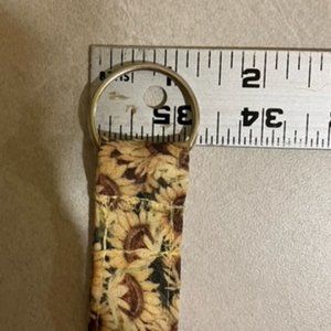 Sunflower Lanyard one inch wide approximately 21" long with the ring.